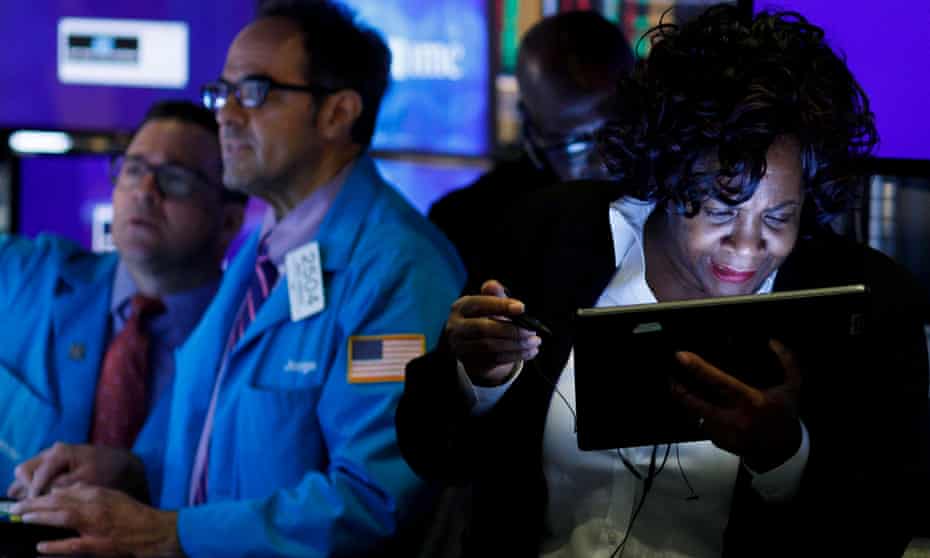 Traders and floor officials at work at the New York Stock Exchange on Monday.