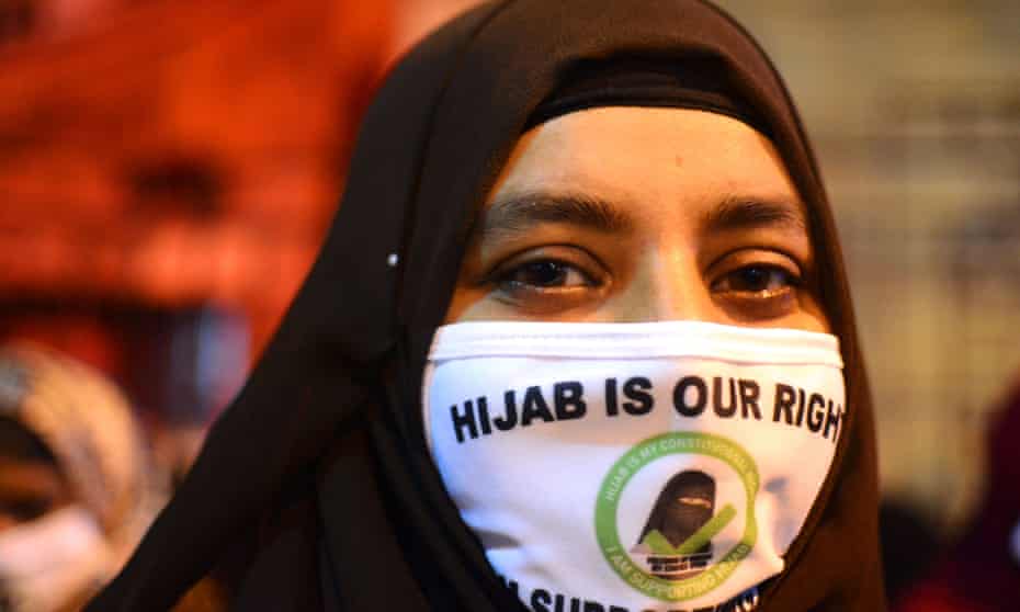 A Muslim woman in Kolkata joins a candlelight protest against the ban on wearing hijabs at schools in Karnataka, India.