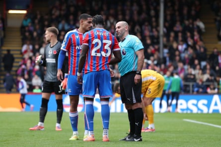 The referee Tim Robinson speaks to Jaydee Canvot