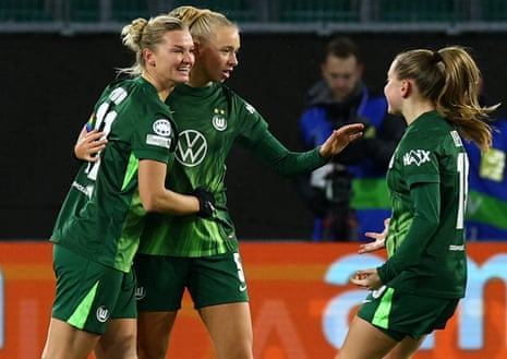 Wolfsburg's Ella Peddemors (centre) celebrates with teammates after restoring parity.