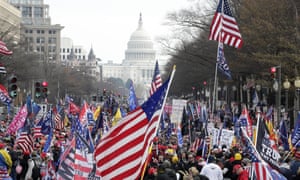 Supporters of Donald Trump stand along Pennsylvania Avenue during a rally at Freedom Plaza, in Washington