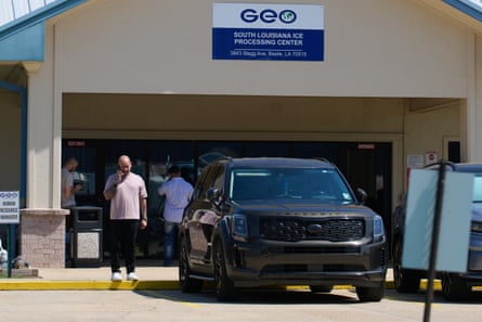 a man stands outside a facility