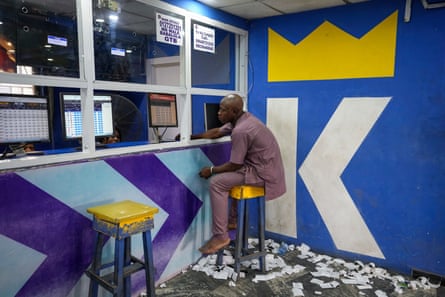 A man plays a World Cup betting game in Lagos, Nigeria