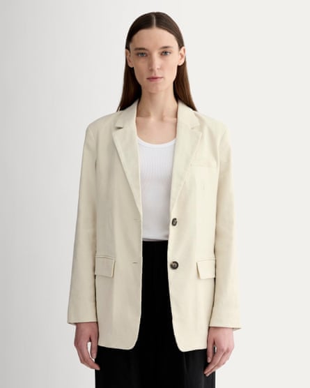 woman wearing oversized cream blazer with black pants