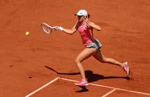Iga Swiatek of Poland hits a forehand.
