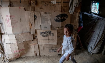 Venezuelan refugees living in La Pista must use cardboard for their shacks until they can find some metal.