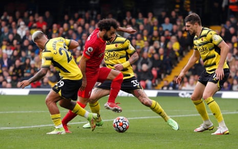 Liverpool’s Mohamed Salah runs past several Watford defenders before he scores their fourth goal during a 5-0 win.