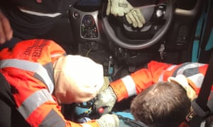 A fire crew cutting the snake free