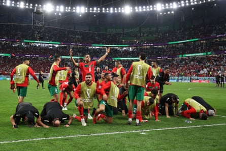 Morocco celebrate their victory after beating Spain at the 2022 World Cup.