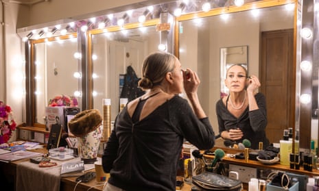 Sarah Jessica Parker applies makeup as she looks into a mirror as she prepares for her role in Plaza Suite at the Savoy theatre, London.