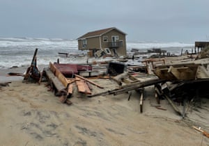 A house collapses into the sea in Rodanthe along North Carolina’s Outer Banks, an area subject to damage from heavy storms and rising tides.