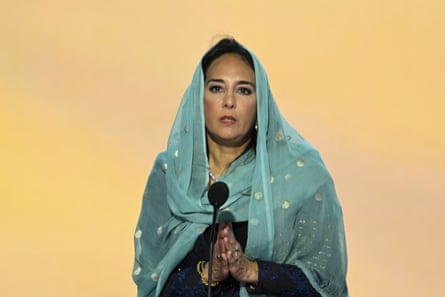 a woman speaks into a microphone