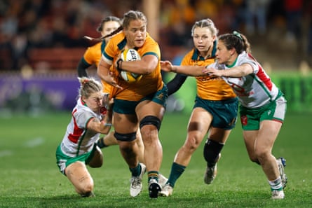 Ashley Marsters of the Wallaroos takes on the Wales defence