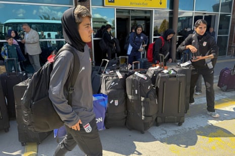 Australia news live: Cyclone Narelle builds to category four storm as it nears Queensland coast; Iranian footballers arrive home