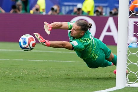 Norway goalkeeper Oerjan Nyland saves the penalty kick.