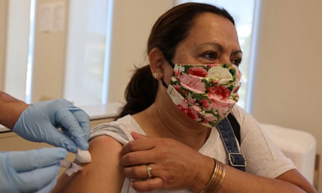 Rosa Hernandez, 56, is given a flu vaccine in East Los Angeles, California Monday.
