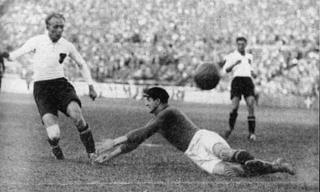Matthias Sindelar lifts the ball over the Belgian goalkeeper to make it 3-0 during Austria’s 4-1 win over Belgium during their June 1933 friendly match in Vienna.