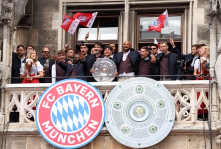 The Bayern Munich squad display the Bundesliga Meisterschale to the crowd of fans at Munich’s Marienplatz.