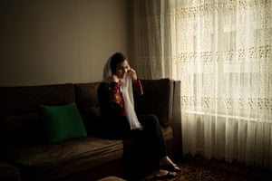 Asita Ferdous sits inside her home in Kabul, Afghanistan on 10 November 2021