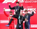Kimi Antonelli is lifted by (from left) Lewis Hamilton, who finished second, Mercedes official Dean Hale and Max Verstappen, who was third.