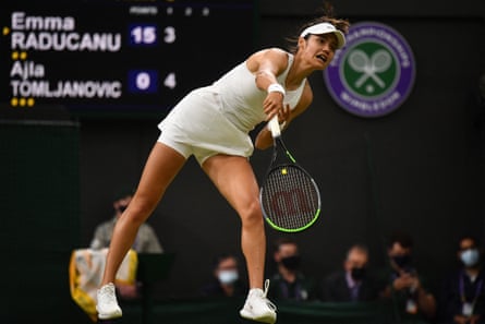 Emma Raducanu serves at Wimbledon 2021
