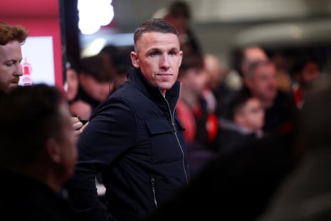 John Rooney, manager of Macclesfield, looks on before the FA Cup fourth-round draw at Anfield.