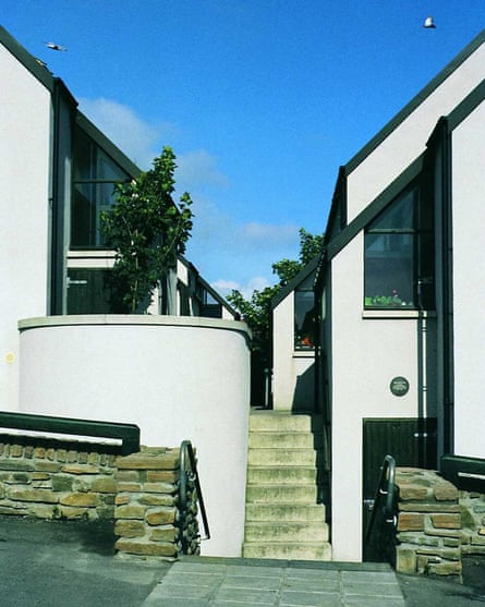 A modernist-looked housing development with white walls and sharp angles