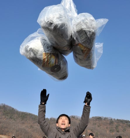 A defector releases a balloon carrying anti-North Korea leaflets at a park in a border town in 2014.