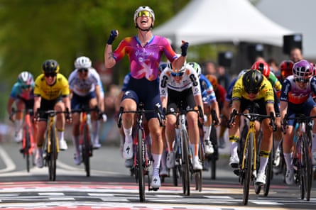 Lorena Wiebes (centre) celebrates but victory went to Marianne Vos (in yellow, right) on the line