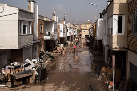 A muddy and damaged road after catastrophic flash floods in Utiel, Valencia