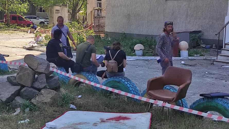 Local residents in Odesa after the missile attack which left at least 18 dead.