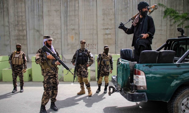 Taliban security forces guarding the neighbourhood where a US drone strike killed Ayman al-Zawahiri.