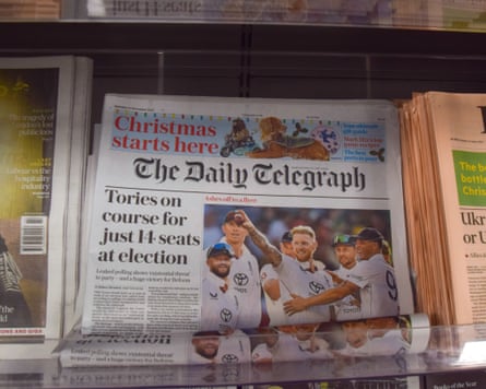 The Telegraph on sale on a newsstand