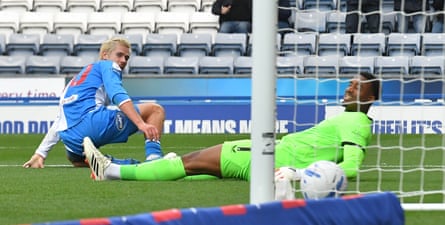 Todd Cantwell watches his effort cross the line, putting Blackburn two up against Cardiff.
