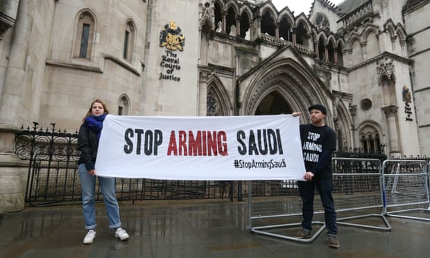 Campaigners hold a banner outside the high court in central London where the legality of UK arms exports to Saudi Arabia is under challenge. 