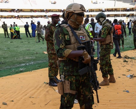 Officers inside Kasarani stadium, where security forces used teargas and opened fire to disperse crowds.