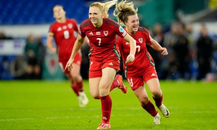 Ceri Holland celebrates her decisive goal for Wales, which put them into a playoff final against the Republic of Ireland.