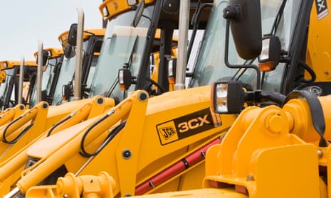 Yellow JCB diggers lined up for shipment