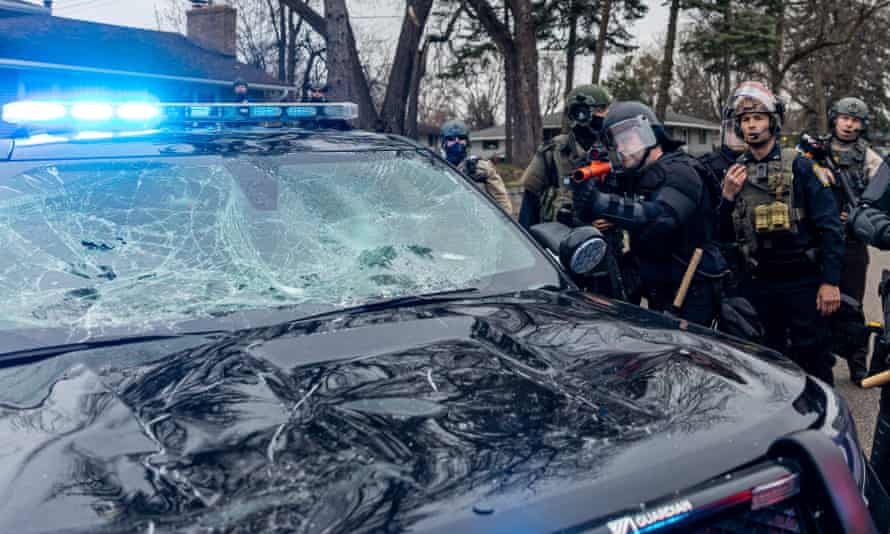 Some protesters damaged police vehicles.