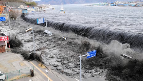 Television helicopter footage captures the tsunami as it devastates north-east Japan