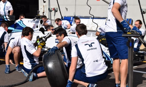 Race against time … the Williams F1 pit-stop team in action.