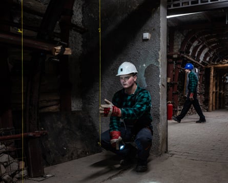 A student miner during a class in a laboratory tunnel