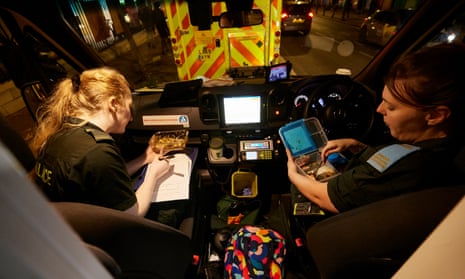 Laura Brown and Jennifer Nelson take a break after carrying a patient to King’s hospital in south London.