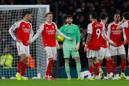 Arsenal players react with dismay after Manchester United’s second goal.