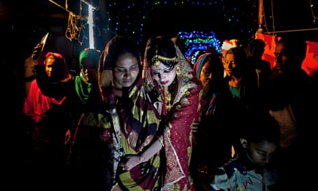 a 15-year-old girl after her marriage ceremony in Manikganj, Bangladesh