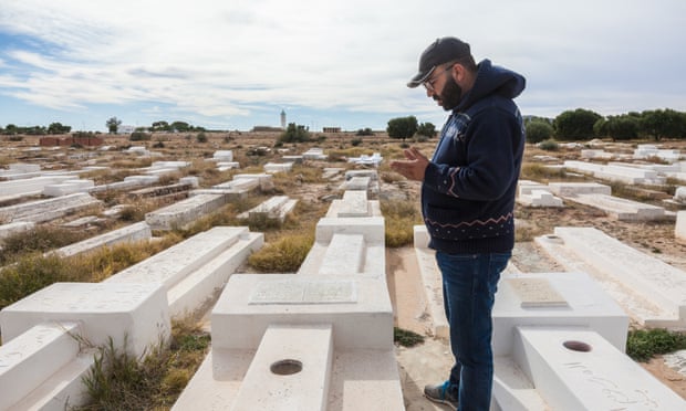 Mohamed Tlili visits the grave of his former schoolmate Mohamed Bouazizi