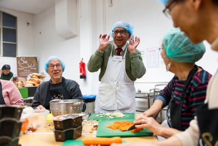 Volunteers chopping vegetables
