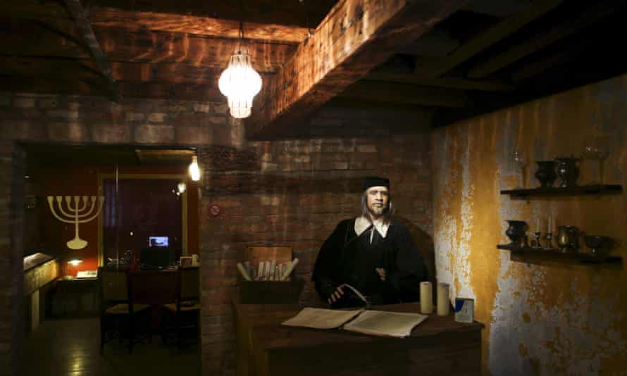 A mannequin of a Jewish money lender with his ledger books in what was once the 16th-century Banco Rosso.
