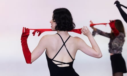 Burlesque dance instructor Evana De Lune in black dress and red gloves