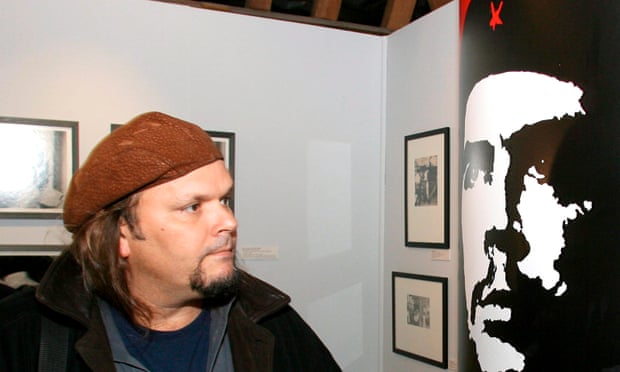 Camilo Guevara, son of Che, comes face to face with the ubiquitous portrait of his father at a 2007 exhibition.